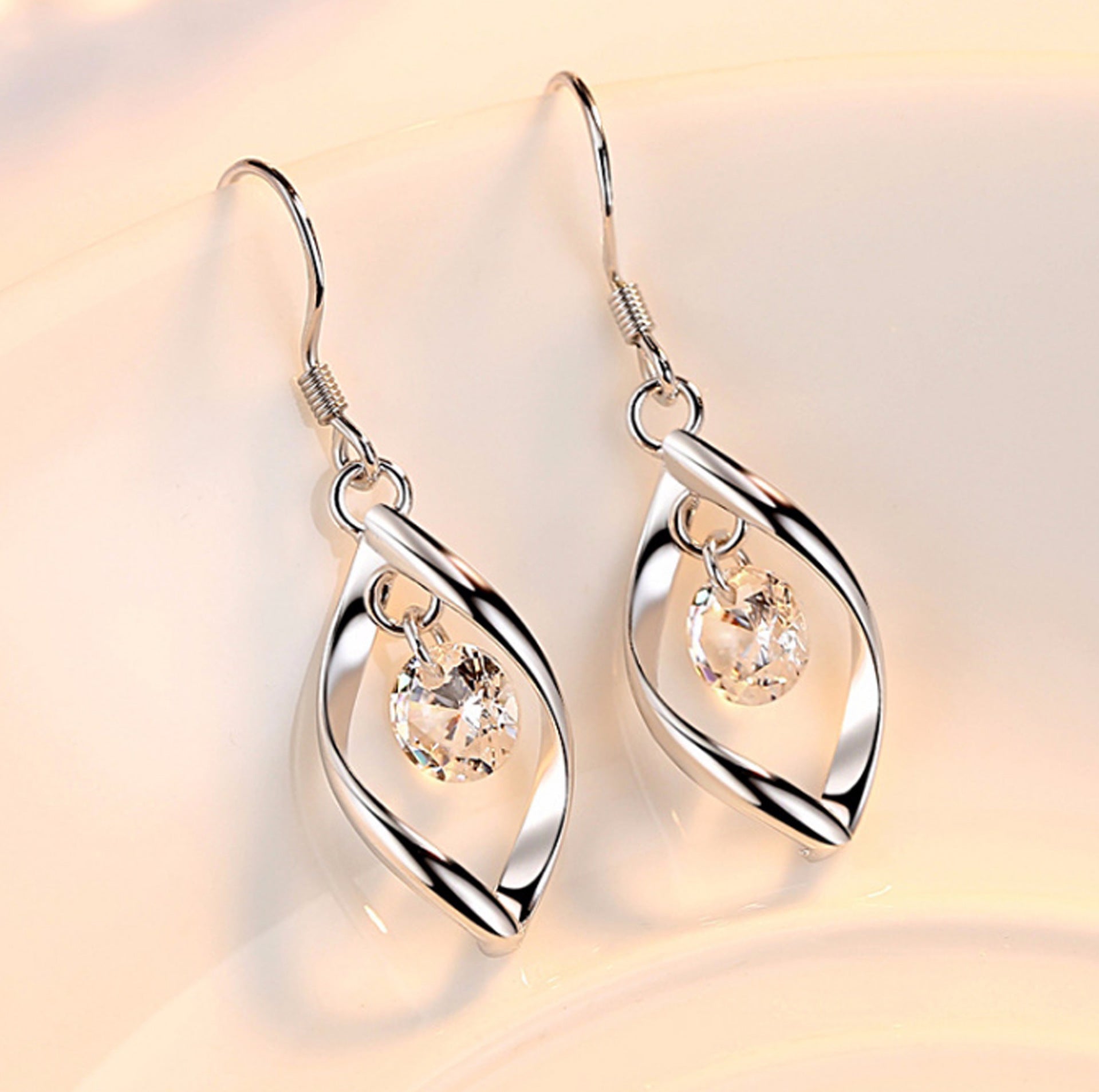 Ametra Radiant Twist – Zirconia Drop Earrings in Platinum Finish
